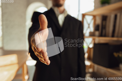 Image of Close up of caucasian male hands, working in office, business, people