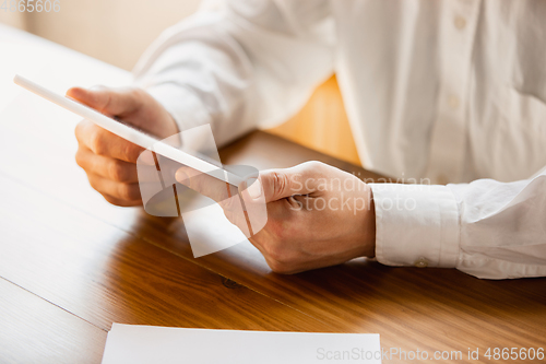 Image of Close up of caucasian male hands, working in office, business, people