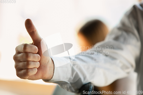 Image of Close up of caucasian male hands, working in office, business, people