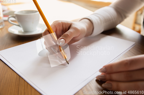 Image of Close up of caucasian female hands, working in office, business, people