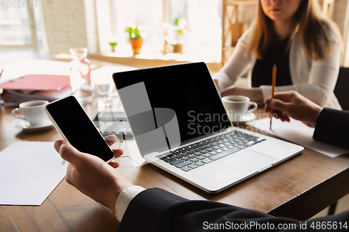 Image of Close up of caucasian male hands, working in office, business, people