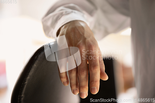 Image of Close up of caucasian male hands, working in office, business, people