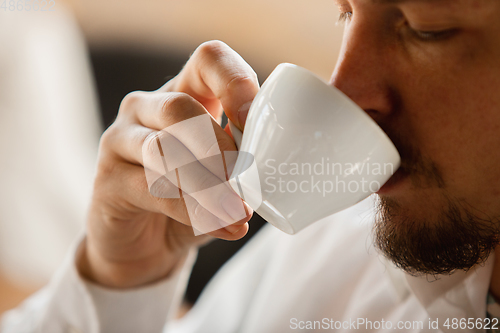 Image of Close up of caucasian male hands, working in office, business, people