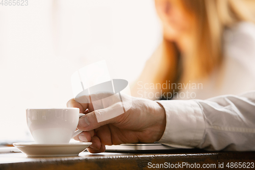Image of Close up of caucasian male hands, working in office, business, people
