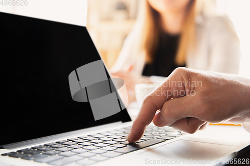 Image of Close up of caucasian male hands, working in office, business, people