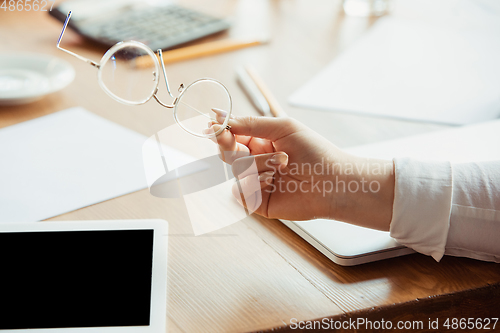 Image of Close up of caucasian female hands, working in office, business, people