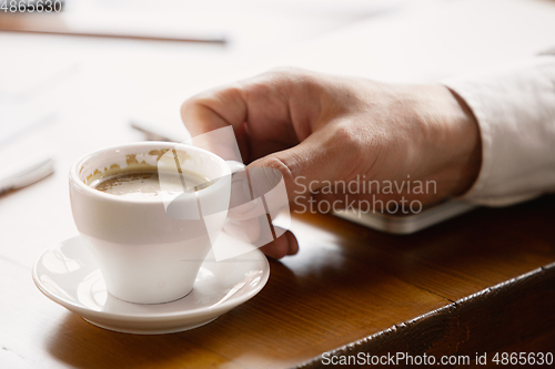 Image of Close up of caucasian male hands, working in office, business, people