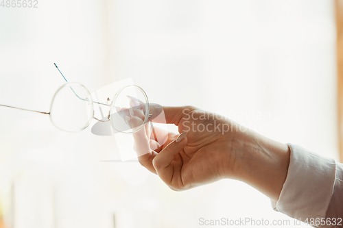 Image of Close up of caucasian female hands, working in office, business, people