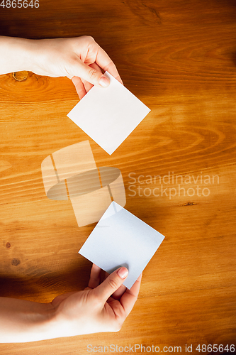 Image of Close up of caucasian female hands during working in office, studying