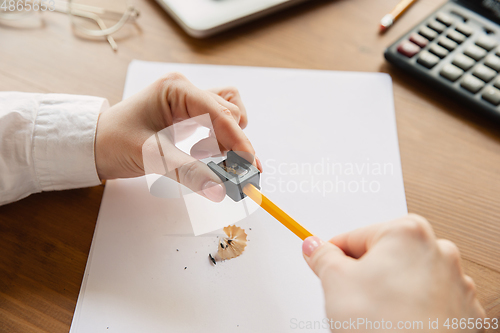 Image of Close up of caucasian female hands, working in office, business, people