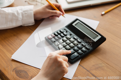 Image of Close up of caucasian female hands, working in office, business, people