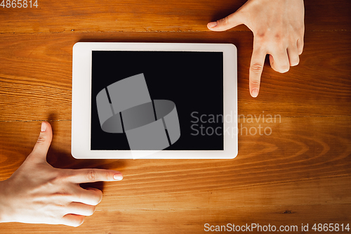 Image of Close up of caucasian female hands during working in office, studying, top view