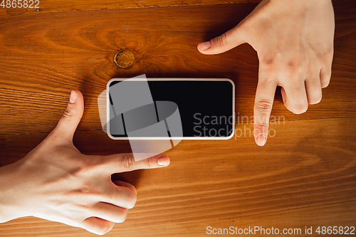 Image of Close up of caucasian female hands during working in office, studying, top view