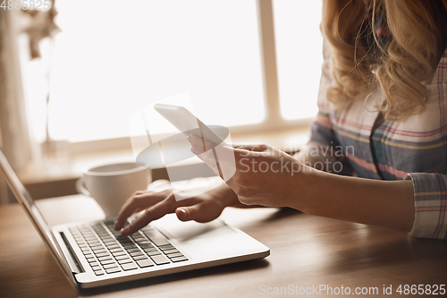 Image of Close up of caucasian female hands during working in office, studying