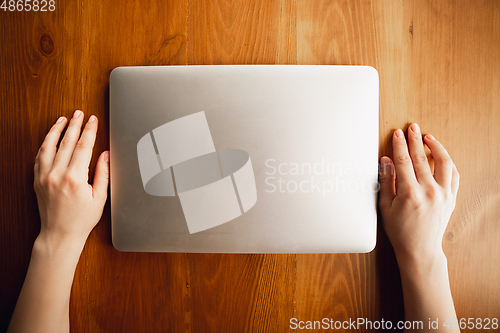Image of Close up of caucasian female hands during working in office, studying, top view