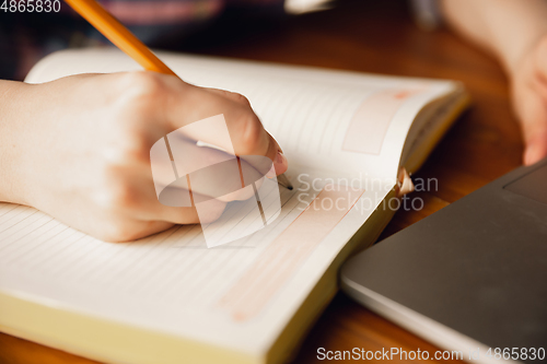 Image of Close up of caucasian female hands during working in office, studying