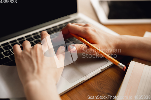 Image of Close up of caucasian female hands during working in office, studying