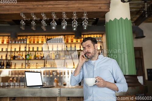 Image of Public institutions closed due to COVID-19 or Coronavirus outbreak lockdown, stressed owner of small business alone in his cafe, restaurant, bar