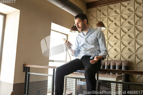 Image of Restaurant, cafe, bar closed due to COVID-19 or Coronavirus outbreak lockdown, stressed owner of small business trying to find solution, need help