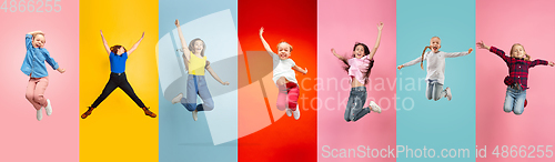 Image of Emotional kids and teens jumping high, look happy and cheerful on multicolored background