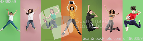 Image of Young emotional people jumping high, look happy and cheerful on multicolored background