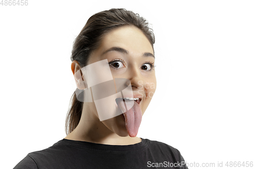 Image of Smiling girl opening her mouth and showing the long big giant tongue isolated on white background, crazy and attracted