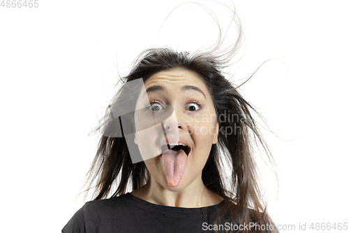 Image of Smiling girl opening her mouth and showing the long big giant tongue isolated on white background, crazy and attracted