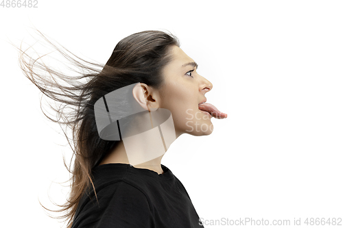 Image of Smiling girl opening her mouth and showing the long big giant tongue isolated on white background, crazy and attracted