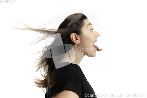 Image of Smiling girl opening her mouth and showing the long big giant tongue isolated on white background, crazy and attracted