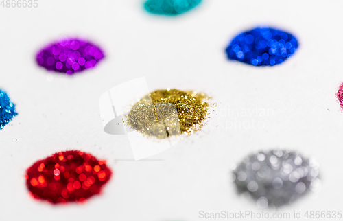 Image of set of glitters on white background