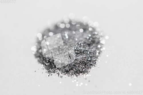 Image of silver glitters on white background