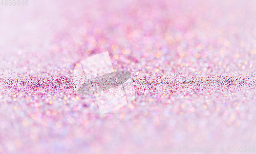 Image of multicolored glitters on white background