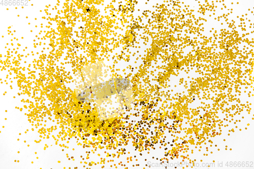 Image of golden glitters on white background