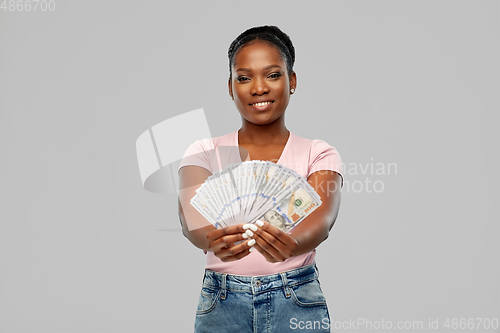 Image of happy african american woman with dollar money