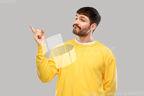 Image of man pointing finger to something