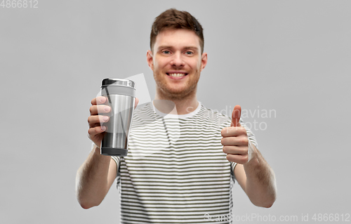 Image of man with thermo cup or tumbler for hot drinks