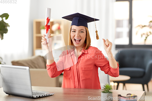 Image of student woman with laptop and diploma at home