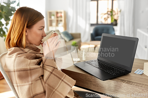 Image of sick woman with tea having video call on laptop