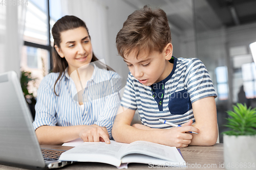 Image of mother and son doing homework together