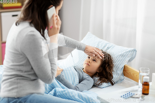 Image of ill daughter and mother calling on phone at home