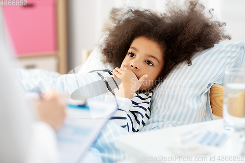 Image of doctor with clipboard and sick girl in bed at home