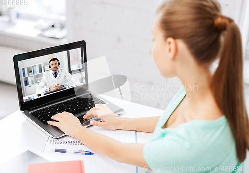 Image of woman having video call with male doctor on laptop