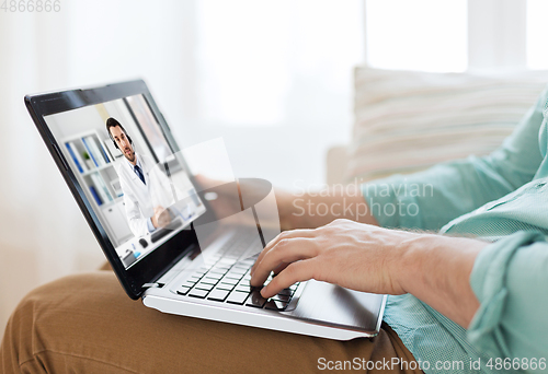 Image of man having video call with male doctor on laptop