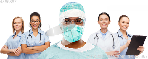 Image of indian doctor or surgeon and healthcare workers