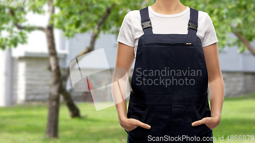 Image of close up of female gardener or builder in overall