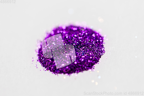 Image of violet glitters on white background