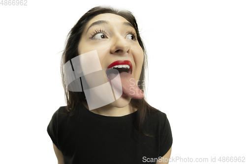 Image of Smiling girl opening her mouth with red lips and showing the long big giant tongue isolated on white background, crazy and attracted