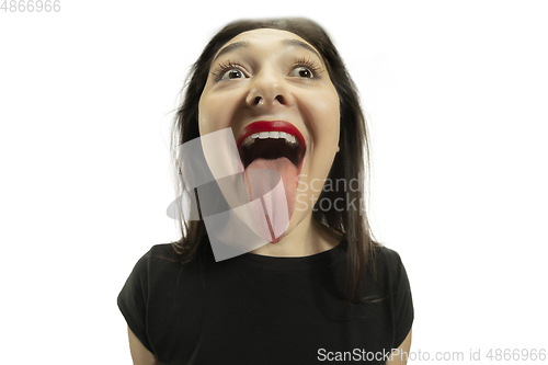 Image of Smiling girl opening her mouth with red lips and showing the long big giant tongue isolated on white background, crazy and attracted