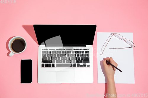 Image of Hand using gadgets, device on top view, blank screen with copyspace, minimalistic style