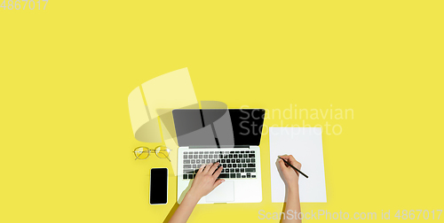 Image of Hand using gadgets, device on top view, blank screen with copyspace, minimalistic style, flyer